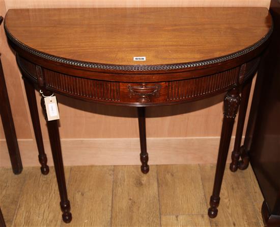A Georgian style carved mahogany demi-lune card table W.92cm